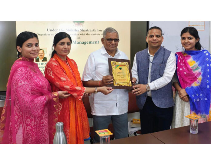 Special guest being presented memento during interaction program at CUJ on Friday.