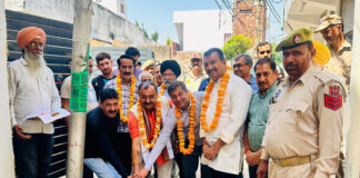 MLA, Vikram Randhawa kick starting upgradation of drainage works in Sanjay Nagar on Friday.