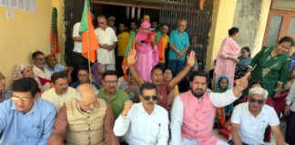 Activists of BJP KDD protesting at Jagti on Monday.