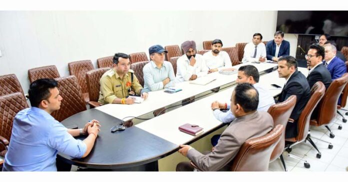 DC Jammu chairing a meeting on Thursday.