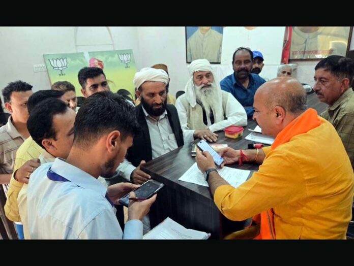 MLA Yudhvir Sethi interacting with public during a darbar in Jammu.