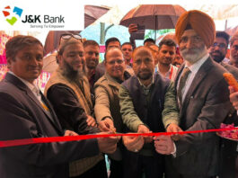 Dignitaries cutting the traditional ribbon to inaugurate a new J&K Bank ATM at Khawas area of Rajouri district on Saturday.