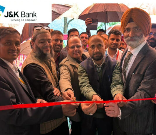 Dignitaries cutting the traditional ribbon to inaugurate a new J&K Bank ATM at Khawas area of Rajouri district on Saturday.