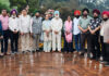 Artists posing at National Painters' Camp organized near Mansar Lake on Friday.