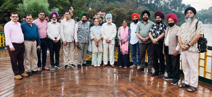 Artists posing at National Painters' Camp organized near Mansar Lake on Friday.