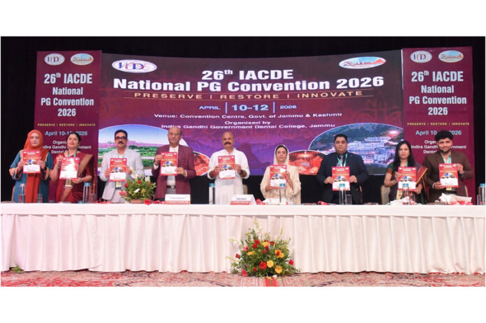 Chief guest and other dignitaries releasing souvenir during IACDE PG National Convention in Jammu. Chief guest and other dignitaries releasing souvenir during IACDE PG National Convention in Jammu.