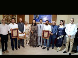 Awardees pose with Chief Justice Jammu, Kashmir and Ladakh High Court Justice Arun Palli, Press Club president Sanjeev Pargal, Maneesh Chhibber and Trust members. -Excelsior/Rakesh