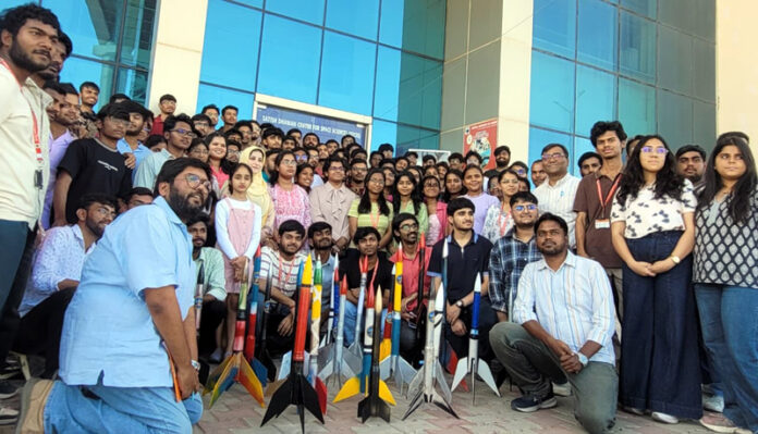 Engineering students posing with rockets at main campus CUJ during culmination of two day workshop on Monday.