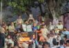 Locals taking out a candle march at Bahu Fort area on Saturday evening.