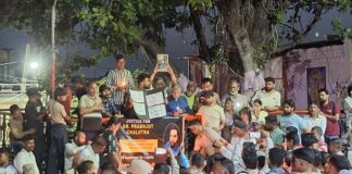 Locals taking out a candle march at Bahu Fort area on Saturday evening.