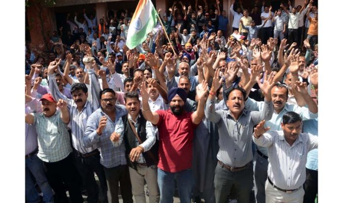 PHE daily wagers staging a protest at BC Road office complex in Jammu. -Excelsior/Rakesh