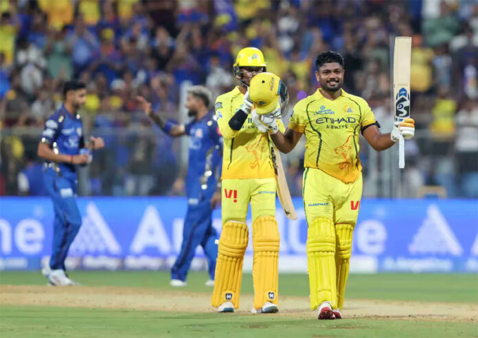 Sanju Samson raising his bat after scoring 101 runs in 54 balls against Mumbai Indians on Thursday.