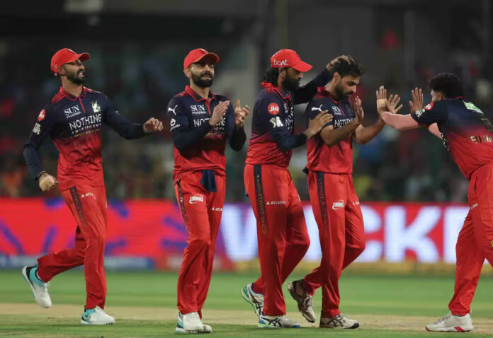 RCB players celebrating after defeating CSK in Bengaluru.