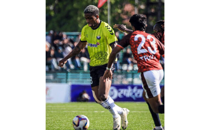 Football players in action during match at TRC Ground Srinagar on Sunday.