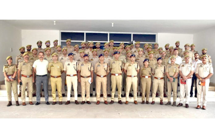 Police officers and officials during a conference in Ramban on Sunday. Police officers and officials during a conference in Ramban on Sunday.