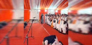 Prime Minister Narendra Modi greets enthusiastic crowd of people during the oath-taking ceremony of Suvendu Adhikari as CM of West Bengal, on Saturday. (UNI)