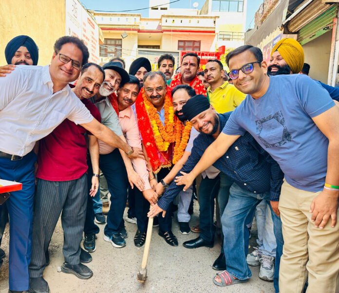 MLA Bahu, Ch Vikram Randhawa kick starting lane and drain work at Nanak Nagar on Monday. MLA Bahu, Ch Vikram Randhawa kick starting lane and drain work at Nanak Nagar on Monday.