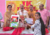 MLA Jammu East Yudhvir Sethi presenting a certificate to a young girl during a programme in Jagti.