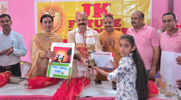 MLA Jammu East Yudhvir Sethi presenting a certificate to a young girl during a programme in Jagti. MLA Jammu East Yudhvir Sethi presenting a certificate to a young girl during a programme in Jagti.