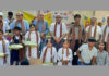 Dignitaries posing along with Divyang students during a programme.