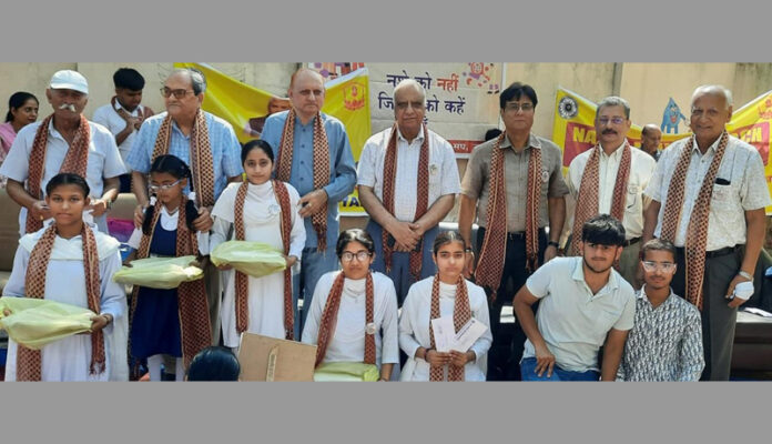 Dignitaries posing along with Divyang students during a programme. Dignitaries posing along with Divyang students during a programme.