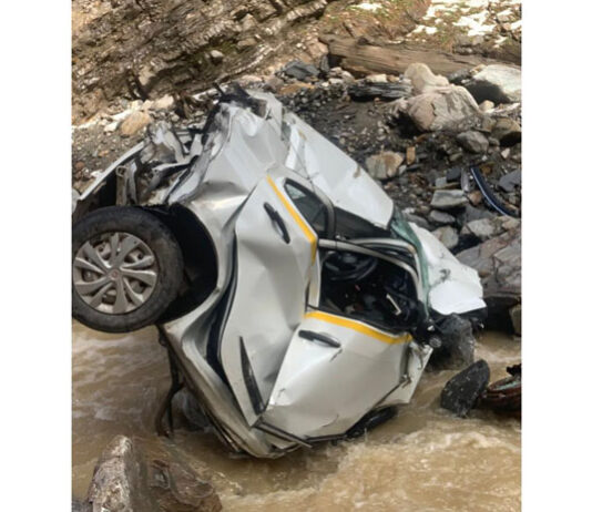 A portion of car lying in deep gorge after accident on Mughal Road in Poonch. -Excelsior/Waseem