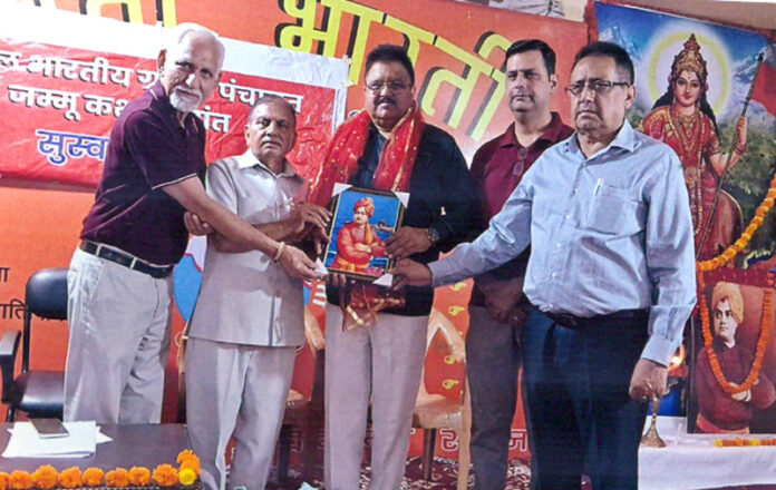 BJP leader Dr Kulbhushan Mohtra receiving honour at a ceremony in Ved Mandir, Jammu.