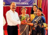 School Management presenting a plant to dignitary during a programme.