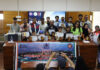 Winners and participants of cycling campaign posing together.
