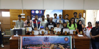 Winners and participants of cycling campaign posing together.