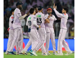 Gujarat Titans players celebrating after defeating Sunrisers Hyderabad in IPL match at Ahmedabad.