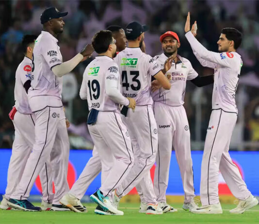 Gujarat Titans players celebrating after defeating Sunrisers Hyderabad in IPL match at Ahmedabad.