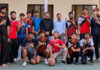 CUJ Basketball team posing for a group photograph along with University Management.