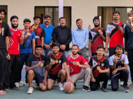 CUJ Basketball team posing for a group photograph along with University Management.