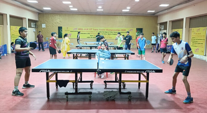 Table Tennis players in action during a match on Tuesday.