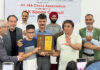 Dignitaries presenting trophy to the winner of J&K UT Level Open Chess Championship.