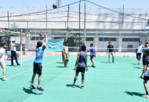 Players in action during a volleyball match on 2nd day of Inter-Zonal District Level Competitions at a venue in Jammu.