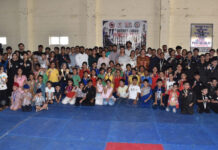 Medal winners posing with guests and officials on conclusion of District Jammu Pencak Silat Championship.