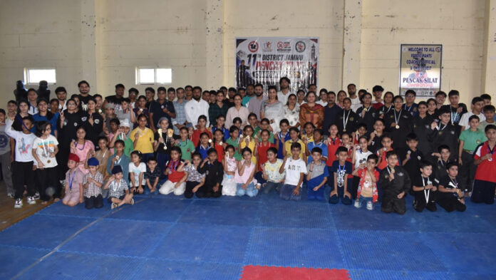Medal winners posing with guests and officials on conclusion of District Jammu Pencak Silat Championship.