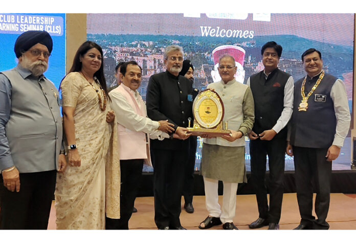 HP Governor Kavinder Gupta being presented a memento during a seminar by Rotary Club at Jammu.
