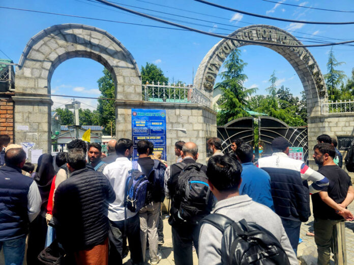 Candidates entering NEET centre in Srinagar on Sunday. -Excelsior/Shakeel