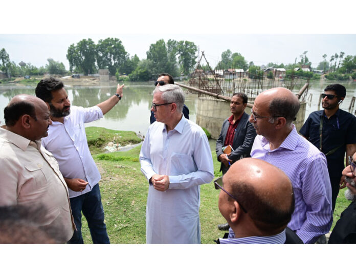 CM inspecting work on a project in Ganderbal on Sunday.