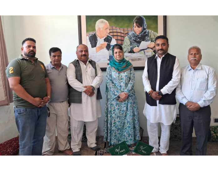 PDP delegation posing for a group photograph with party president Mehbooba Mufti in Srinagar.