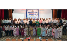 DG Prosecution Deepak Kumar posing with prosecutors and officers for a group photograph at Police Auditorium in Jammu on Sunday.