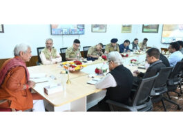 LG chairing a meeting at Srinagar on Sunday.