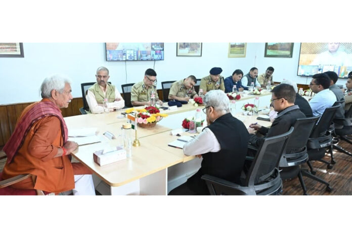 LG chairing a meeting at Srinagar on Sunday.