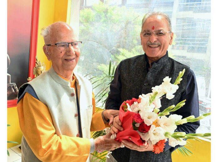 HP Governor and ex-CM exchanging greetings on Saturday. HP Governor and ex-CM exchanging greetings on Saturday.
