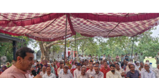 MLA Jasrotia addressing a public gathering after inaugurating development works.
