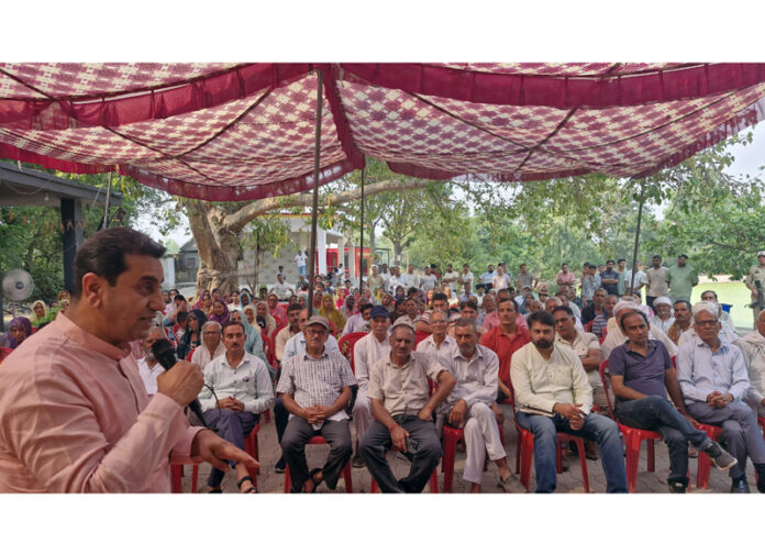 MLA Jasrotia addressing a public gathering after inaugurating development works.