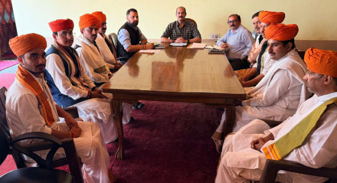 Trustee, J&K Dharmarth Trust, Vikramaditya Singh chairing a meeting of senior officials and pujaris at Srinagar.